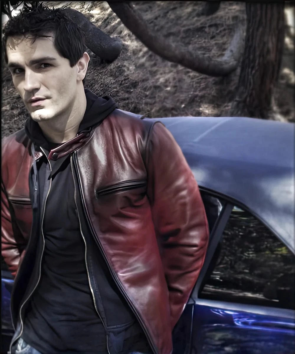 Model wearing red cafe racer leather jacket outdoors with zip front and slim fit silhouette