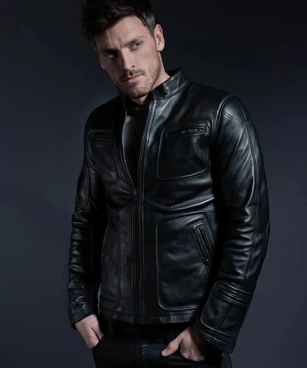 Male model wearing a black leather Kirk premium leather jacket with modern slim fit styling, band collar, zip front, oversized chest pockets, and sci-fi inspired panel detailing