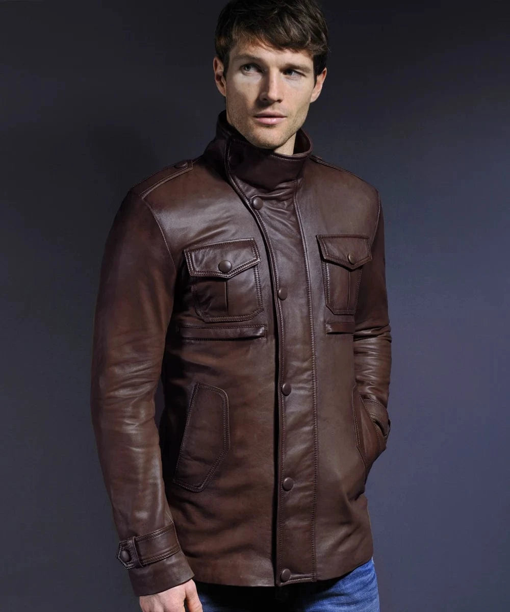 Model wearing vintage brown leather field jacket with slim fit styling and utility pocket detailing, worn fully closed
