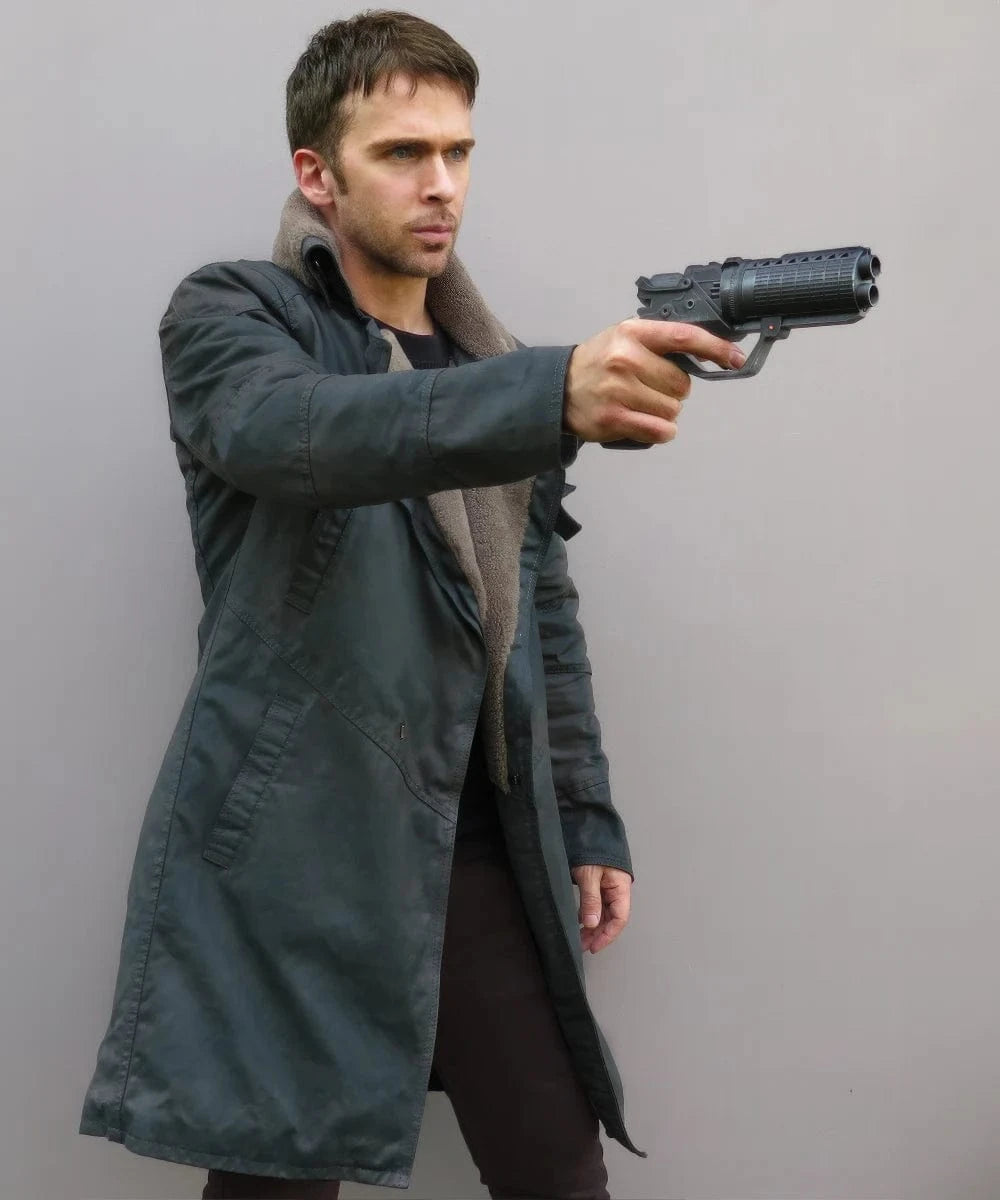 Man wearing the Blade Runner 2049 coat in an action shot.