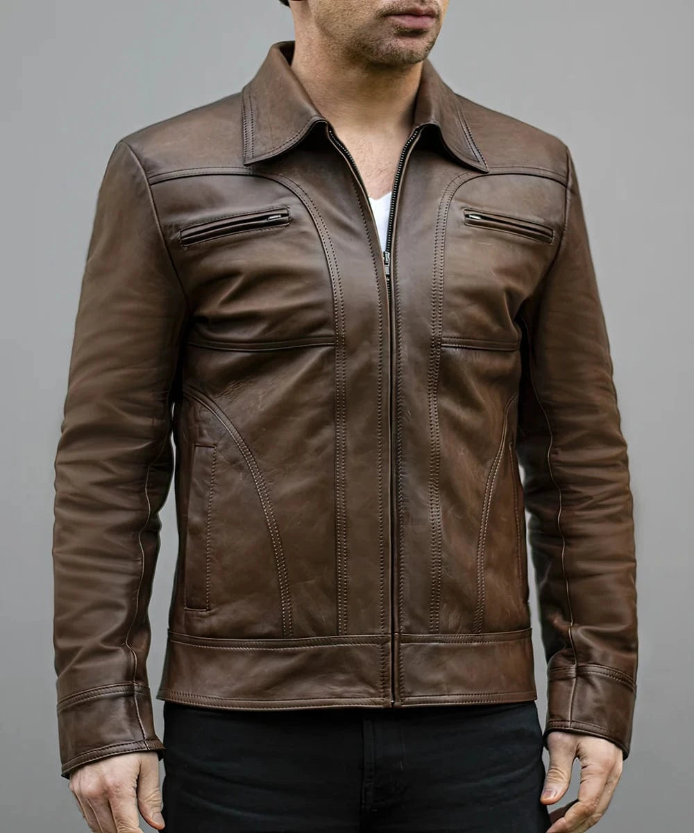 Model wearing vintage brown leather jacket with slim fit styling and zip chest pocket detailing