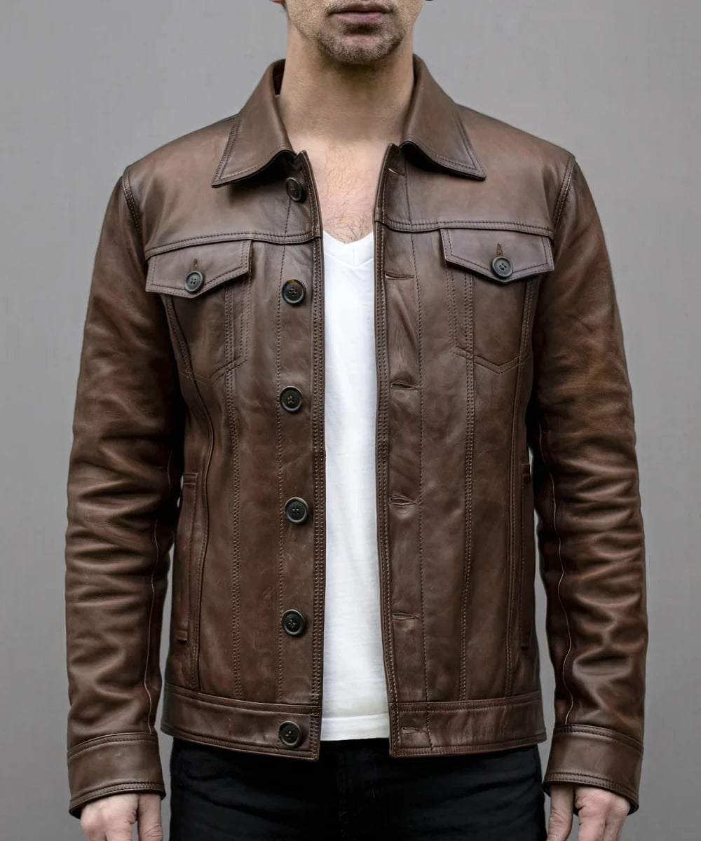 Model wearing vintage brown leather trucker jacket with slim fit styling and classic trucker inspired design