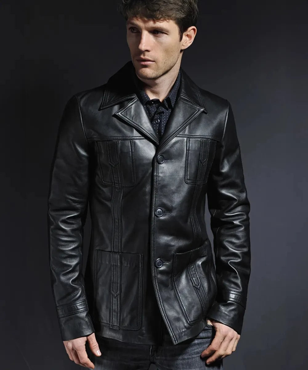 Male model wearing a black leather Life on Mars jacket with a modern slim fit, vintage wide collar, button front closure, and retro 1970s premium detailing