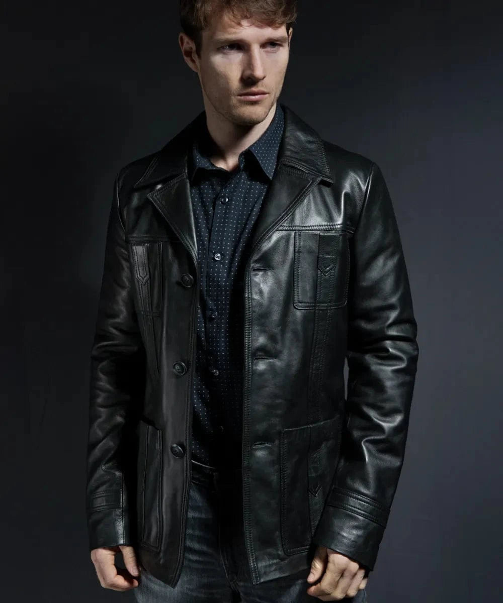 Male model wearing a black leather Life on Mars jacket showing premium tailoring, vintage wide collar, button front closure, and retro utility pocket detailing