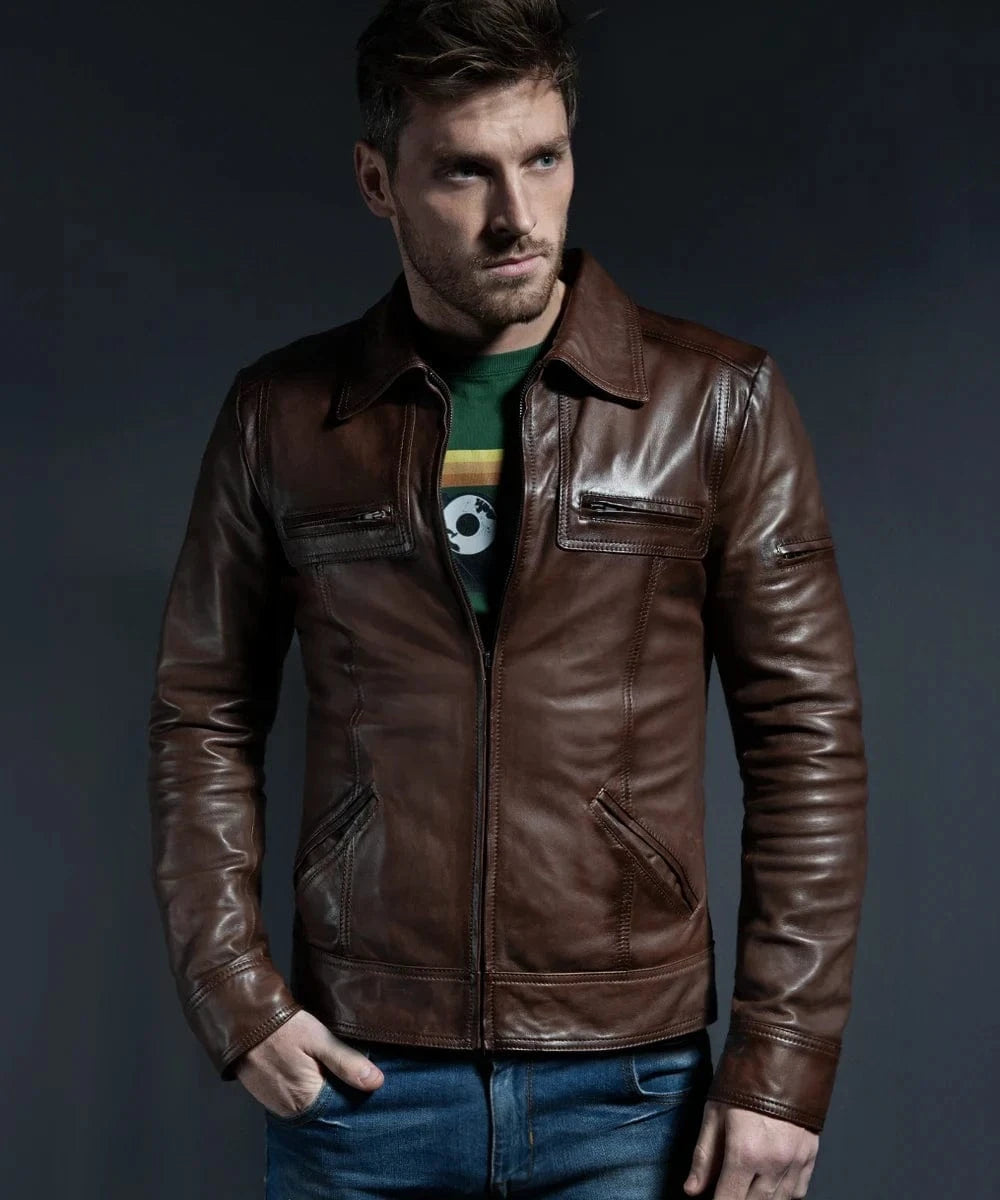 Model wearing vintage slim fit brown leather jacket with retro pointed collar styling and zip chest pocket detailing