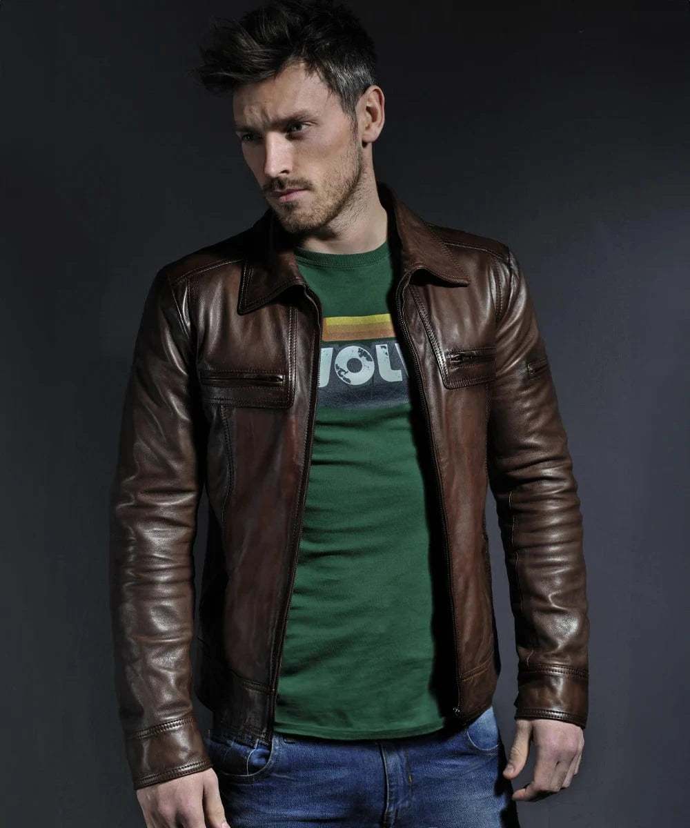Model wearing vintage slim fit brown leather jacket with retro pointed collar styling and zip chest pocket detailing