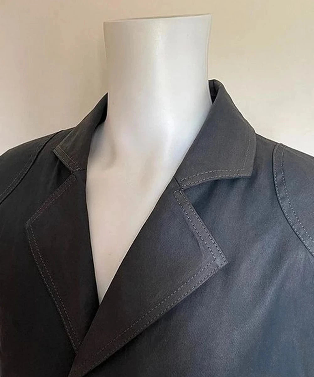 Detail view of lapel and collar on green Billy Butcher style coat