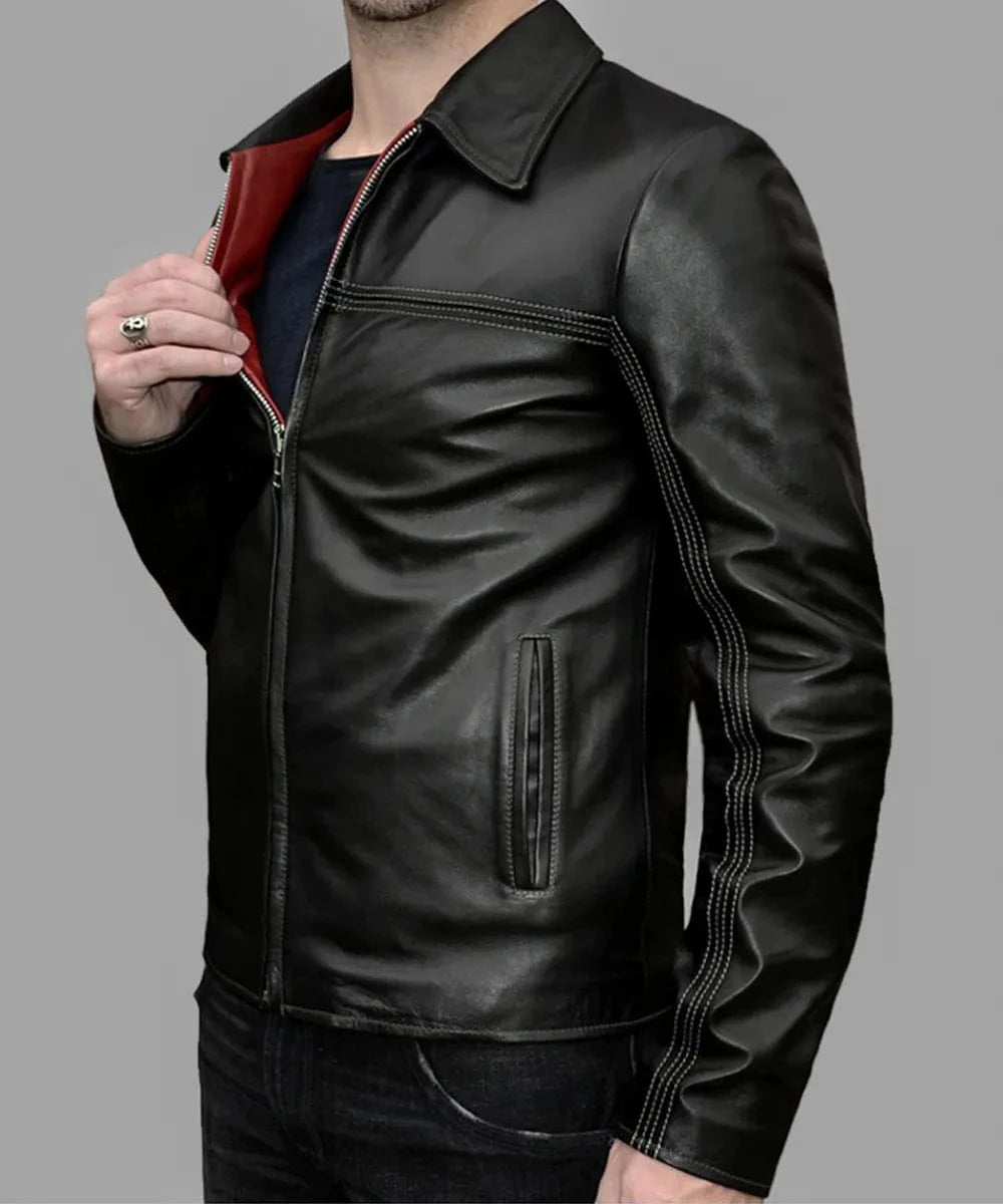 Close-up view of the black leather Layer Cake jacket featuring slim fit styling, vintage collar, contrast stitching, zip front closure, and deep red interior lining detail